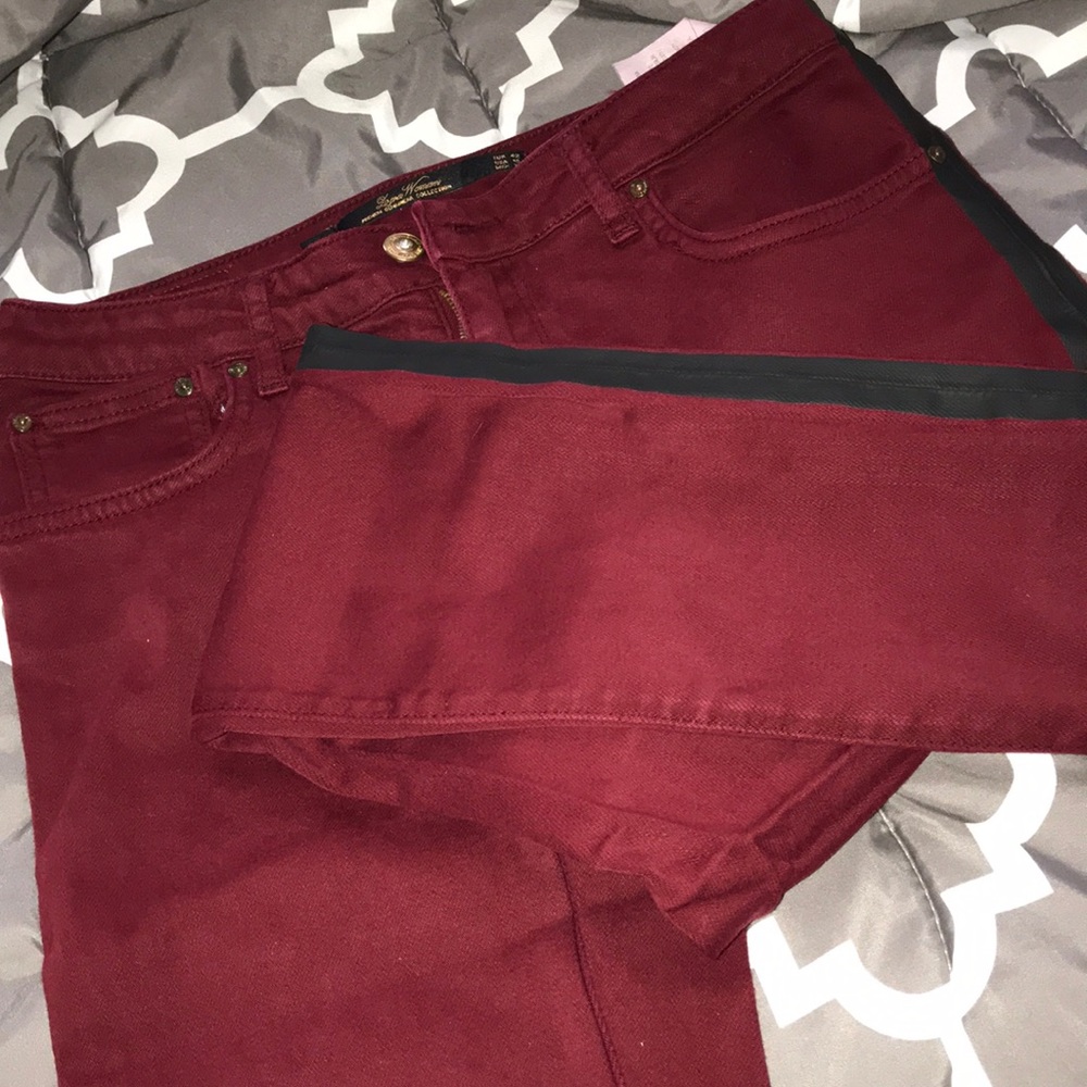 Burgundy jeans with black stripe on the side